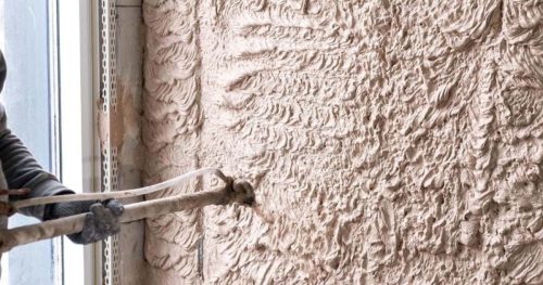 spraying gypsum plaster